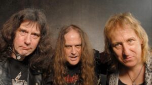 “Nous reviendrons” : Raven reporte sa tournée européenne suite à l’hospitalisation de John Gallagher